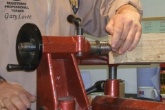 Here Gary is fixing the tailstock, having mounted the other end in the chuck.