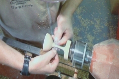 This screen shot shows Gary sanding the delacate stem.