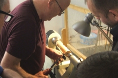 Here David is showing how to use a gouge on end grain with some of the members looking on.