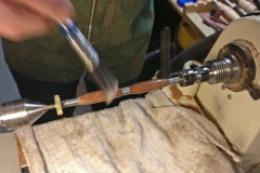 Dave can be seen applying a sealer to the pen.