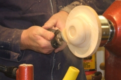 He used a hand held sanding system that worked on friction, progressing through the grades of discs.