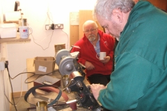 Here we have David Hay at the sharpening station, being observed by some of the members.