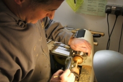 The goblet that David Hutcheson is making nears completion, here he is applying some sealer to his goblet.
