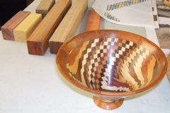 David's finished bowl in the foreground, with some of the timbers he used in the background.