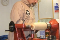 Using a roughing gouge Garry brings the blank of Beech to a cylinder.