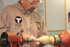 Here he is buffing the wax finish he applied to the item.This completed the first part, the base.