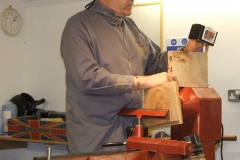 Mark shows the crowd some of the paints he uses in his work.