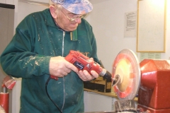 If you use a spigot for the base, it will need to be removed, this is done with a set of bowl jaws. Here I'm sanding the base after removing the spigot.