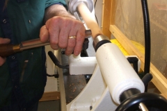 Here David can be seen taking the blank down to the round using a roughing gouge.