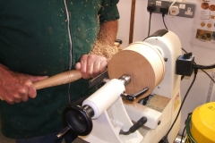 Here Dave is using a bowl gouge to bring the blank to his ideal size.