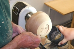 Here Dave is sanding the outside shape, the chuck recess can be seen with some decoration.