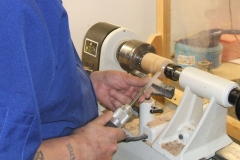 Colin MacKenzie making progress on his miniature bird house.