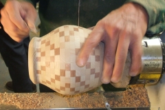 Dave Line hand sanding some small areas on his laminated vessel.