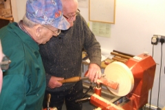 Here we have Bill Henderson making his first cuts on a bowl blank using a bowl gouge, being supervised by myself.