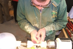 Dave line sanding the stem of the goblet.