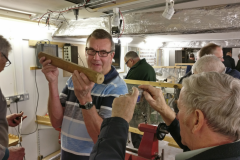 Here I am trying to get the picture through the wood whilst Dave tried to hold it steady.Picture by Phil Moore.