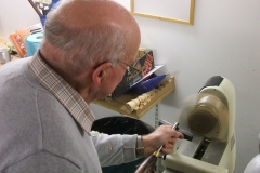 Here we have Bob Chisholm as he makes a start on his bowl, Bob was using a piece of Yew, this picture gives you a perfect view of what the turner sees as he makes his cuts, the ghosting is quite obvious.