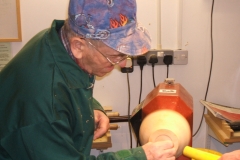 Sanding the chuck by hand where the jaws will sit.