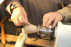 Douglas's Pear being sanded prior to being removed from the lathe and the stalk inserted.