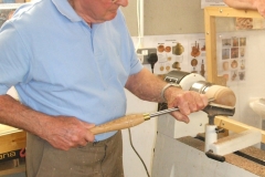 Here we have Bob Chisholm as he starts to make a wooden Orange from a piece of Elm wood.