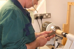 Here we have David Hobson as he starts to make a wooden pear from a piece of Zebrano wood.