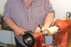 Here we have Richard Comfort as he make a start on making a wooden pear from a piece of Elm wood.