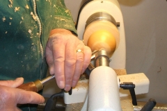 Here John Ruickbie is now shaping the top of the apple.