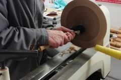 Bill is sanding the inside of his platter.