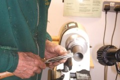 Here Nick is finishing off the top lip of his cup. He went on to make a top for the cup, also threaded.