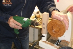 David drilling the hole for the cable using a home made jig to get the hole in the right place.