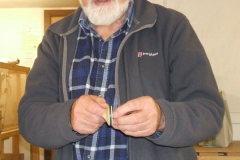 Douglas was also into making wooden toys, here he is showing a small spinning top he had made.