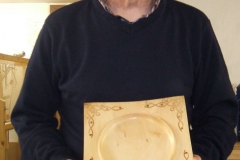 A shallow square bowl made from Lime with some Laser designs on the corners.