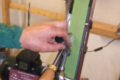 David Hay using the sharpening jig to sharpen a bowl gouge.