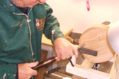 Here I am trying a gouge for sharpness after re-grinding and sharpening.