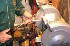 Here I am working on a second bowl gouge using the white wheel to remove some of the wings and also to sharpen.